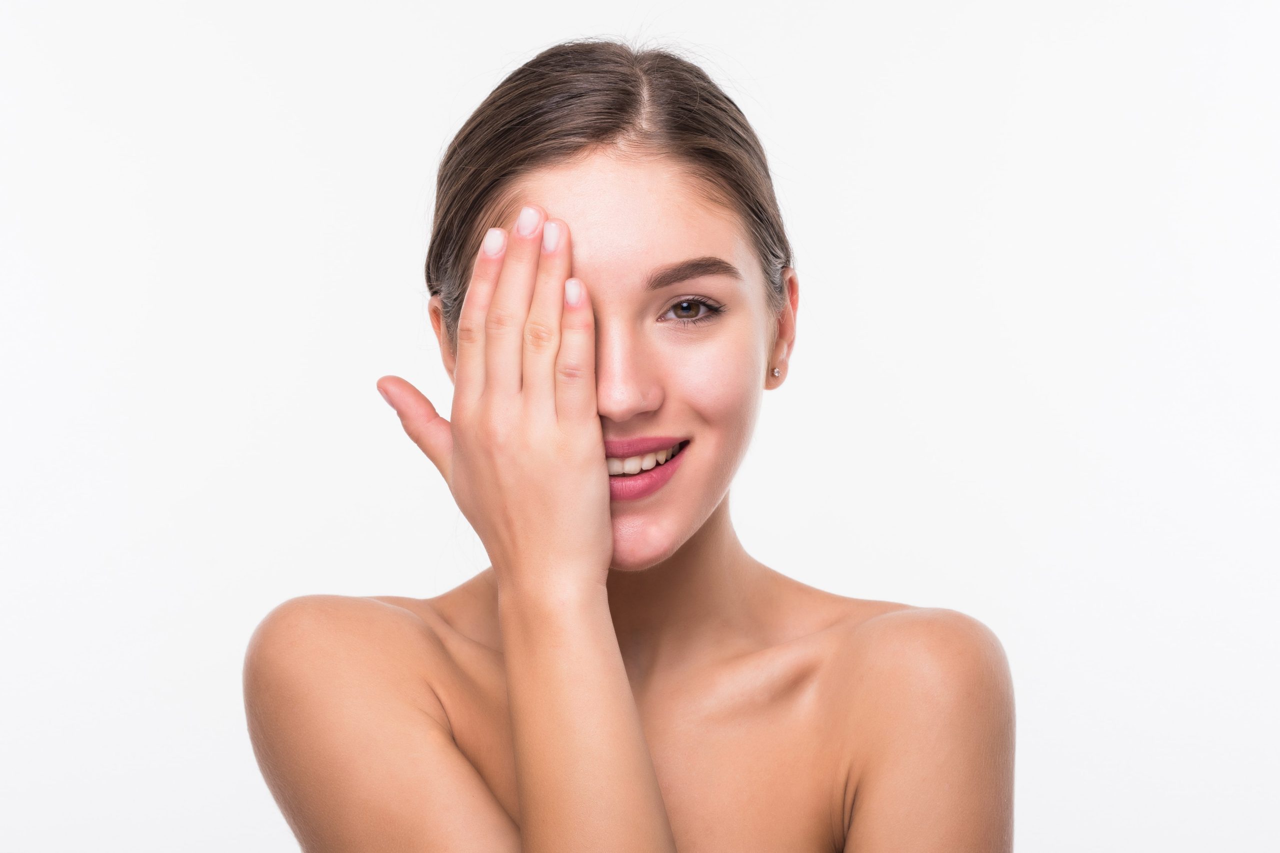 a woman covering her face with her hand